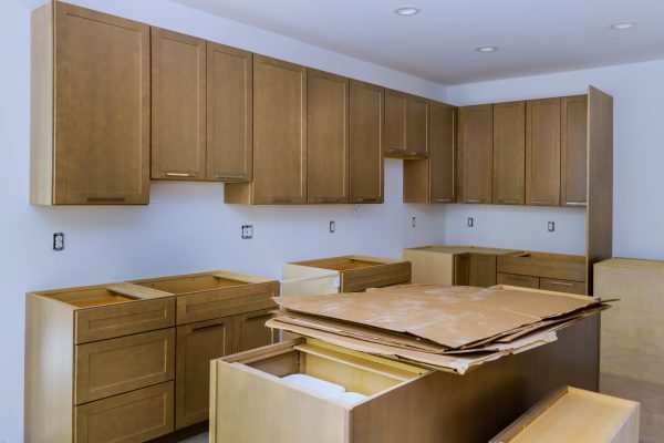Interior design construction of kitchen remodel with cabinet maker installing home improvement custom