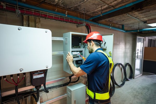 Service Engineer use tablet working inspection installation inverter solar cell. Technician maintenance solar cells. Technology solar energy renewable.